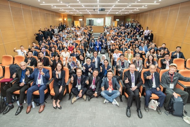 Group photo of speakers and participants at the conference