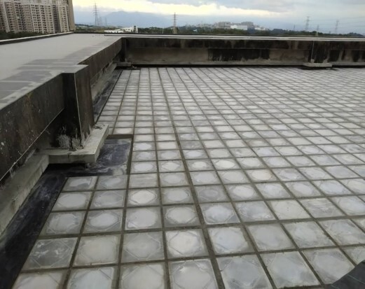 Insulation tiles installed on the rooftops of each building